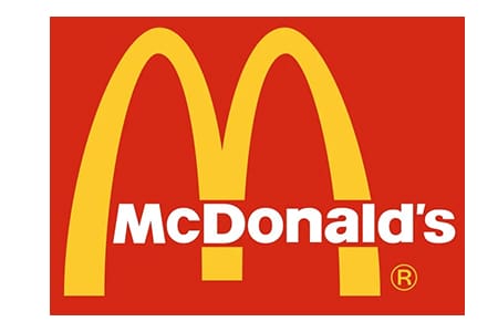 McDonald's golden arches on red background