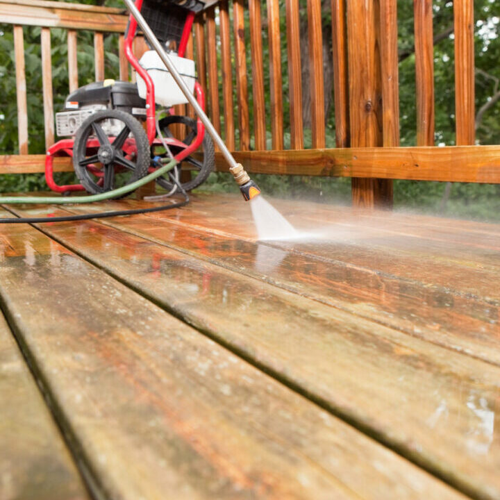 Pressure washing a wooden deck